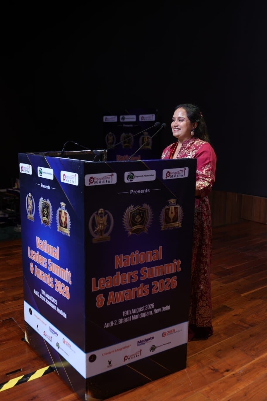 Mamta Pandey speaking at the podium during the National Leaders Summit & Awards 2026 at Bharat Mandapam, New Delhi